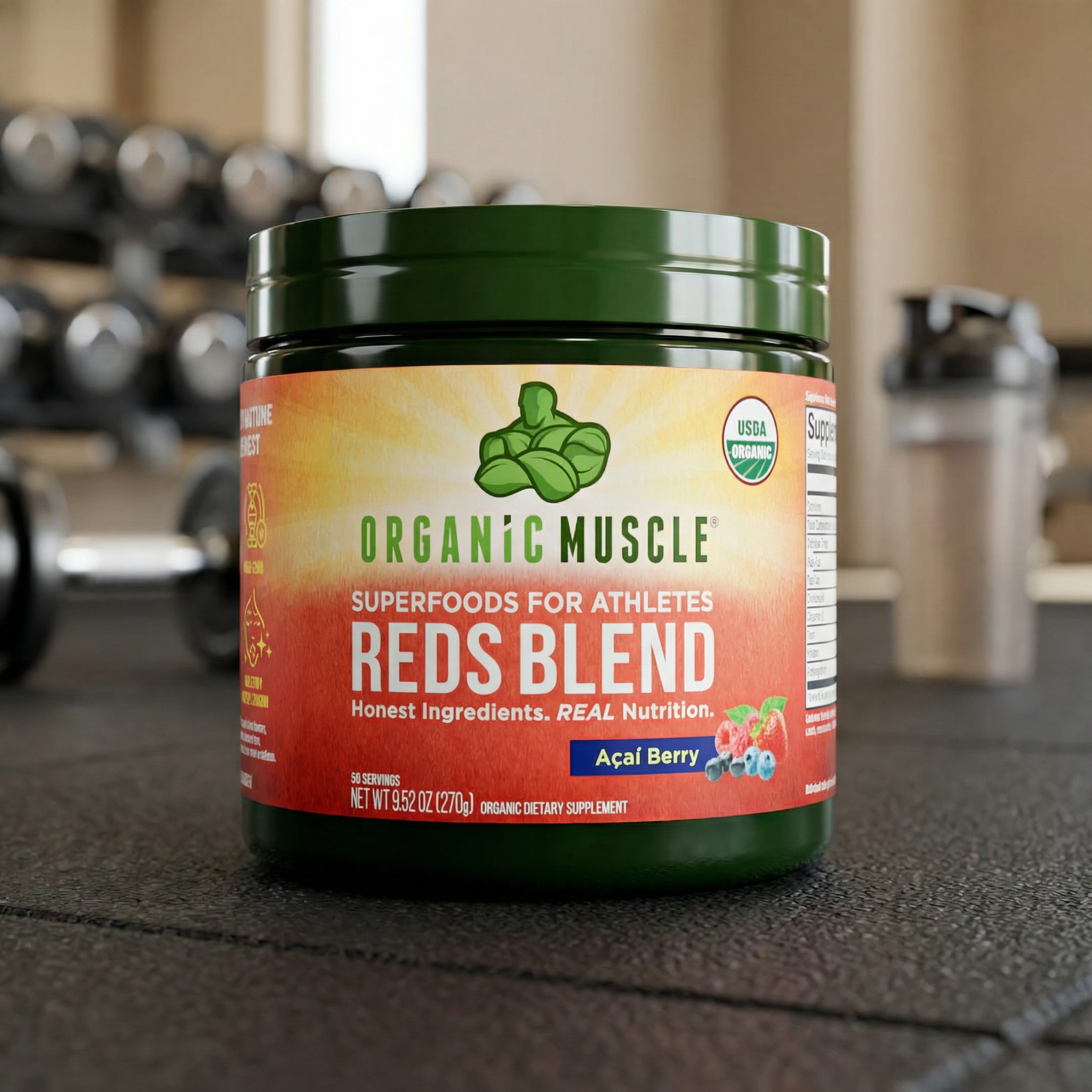 Container of Organic Muscle Reds Blend supplement in a gym setting