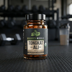 Supplement bottle labeled 'Tongkat Ali' on a gym bench with blurred gym equipment in the background
